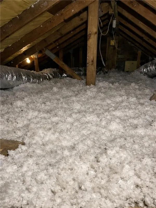 Blown-in attic insulation installed across an attic floor in a Shreveport home